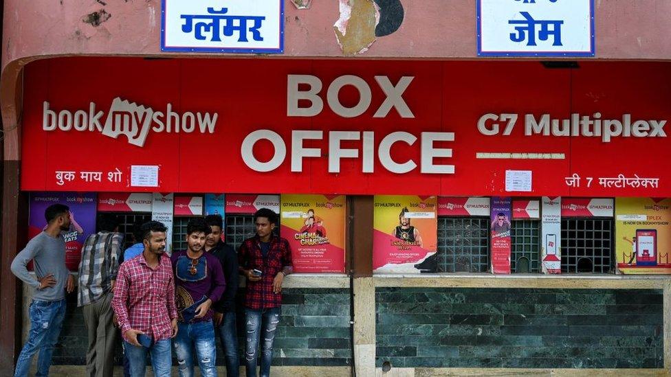 In this picture taken on October 1, 2022, moviegoers wait at the ticket counters outside the G7 multiplex in Mumbai. - India's Bollywood film industry, long part of the cultural fabric of the movie-mad country of 1.4 billion people, is facing its biggest-ever crisis as streaming services and non-Hindi language rivals steal its sparkle.