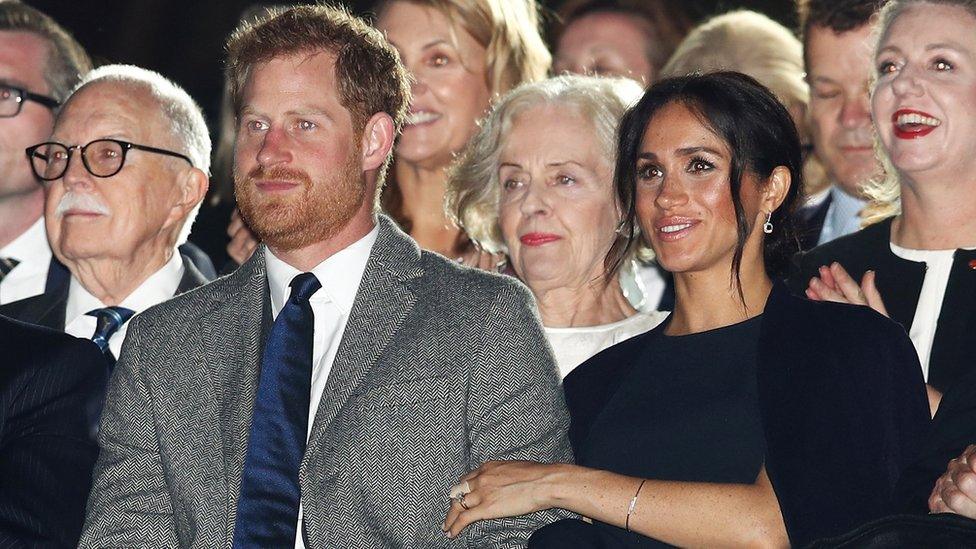 Harry and Meghan watching the opening ceremony