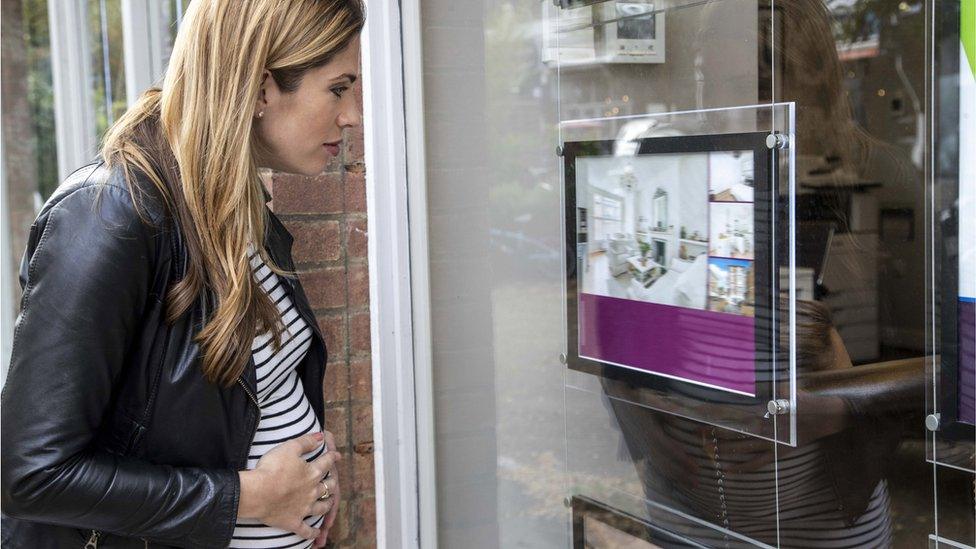 Woman at estate agents