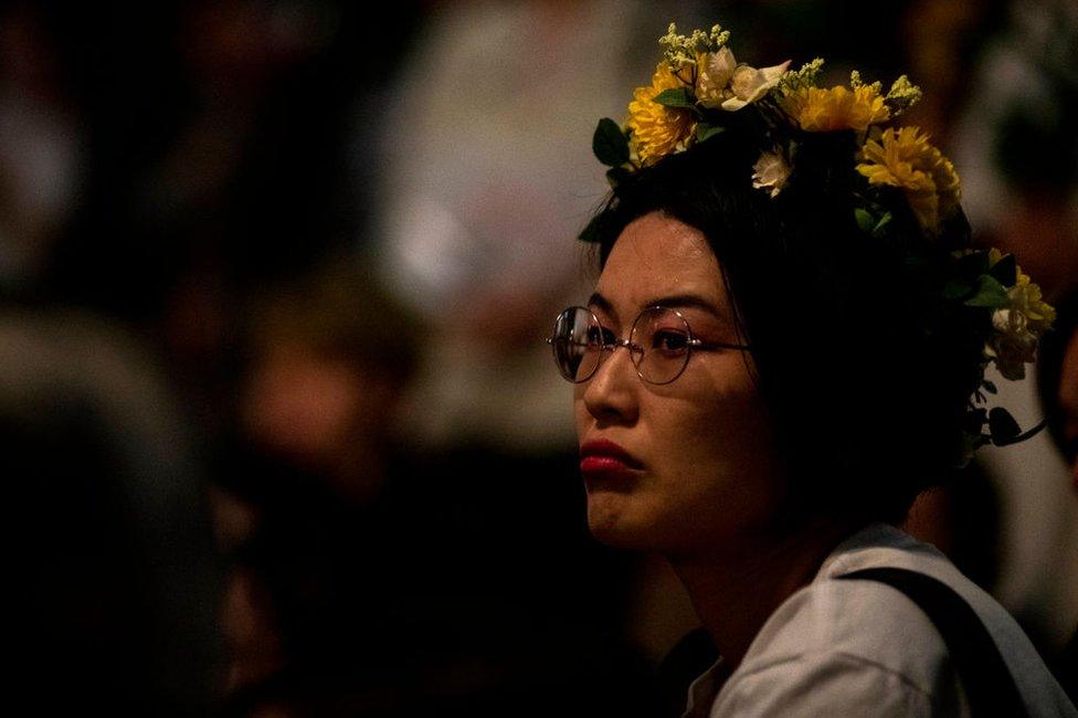 Protesters, about 150, gather at the rally called 'Flower Demo' to criticize recent acquittals in court cases of alleged rape in Japan and call for revision of the anti-sex crime law, in front of Tokyo Station in Tokyo, Japan June 11, 2019.