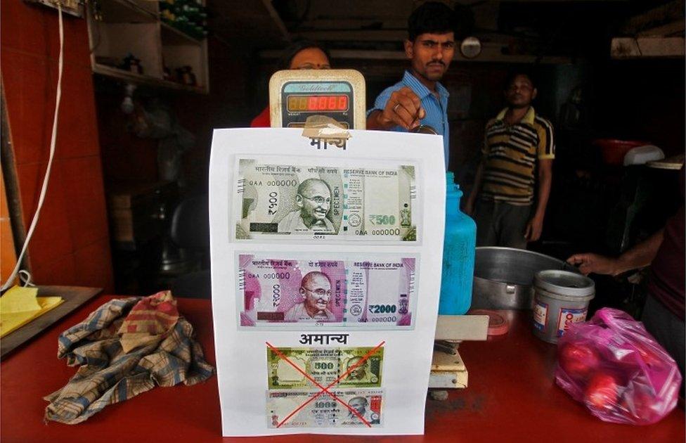 A notice is pasted at a shop stating the refusal of the acceptance of the old 500 and 1000 Indian rupee banknotes and acceptance of the new 500 and 2000 Indian rupee banknotes, in Allahabad, India, November 10, 2016