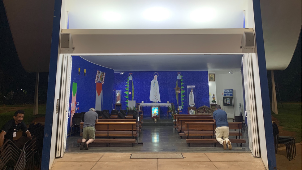 Worshipers pray at the Our Lady of Fatima church