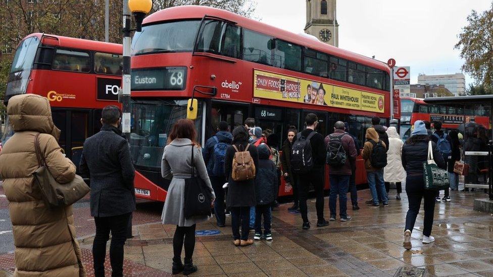 commuters and a bus