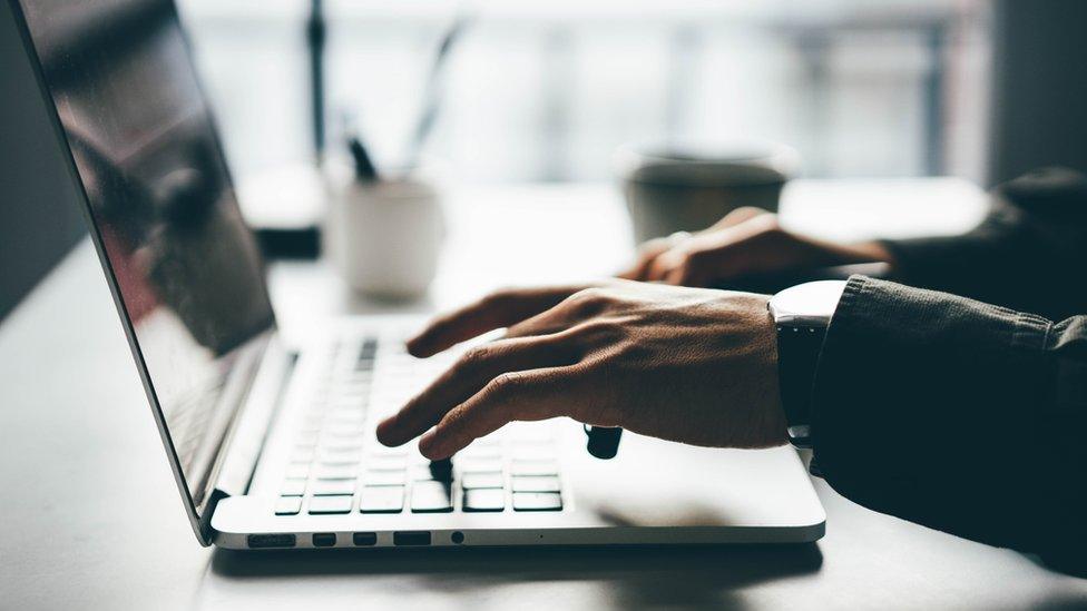 Man using laptop (stock image)