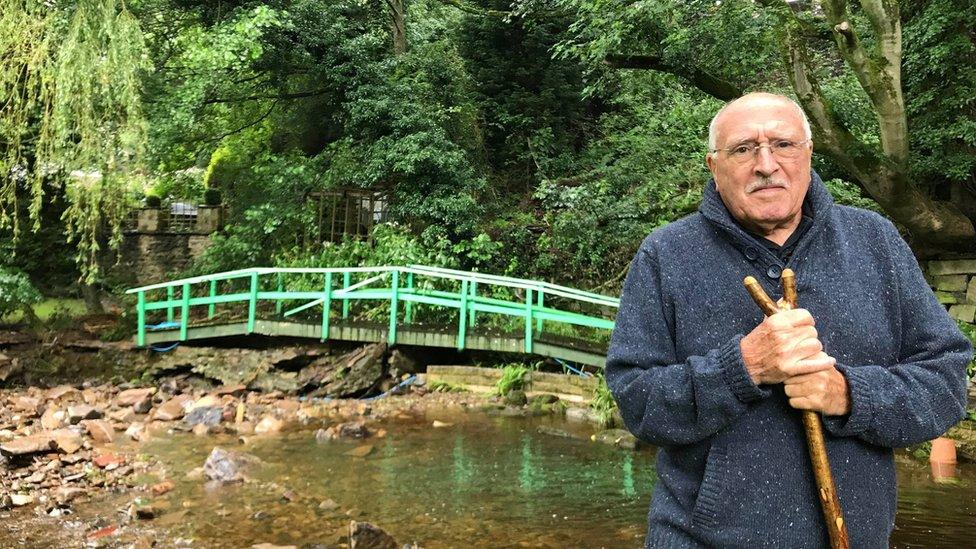 Bryan Ross in front of the broken bridge