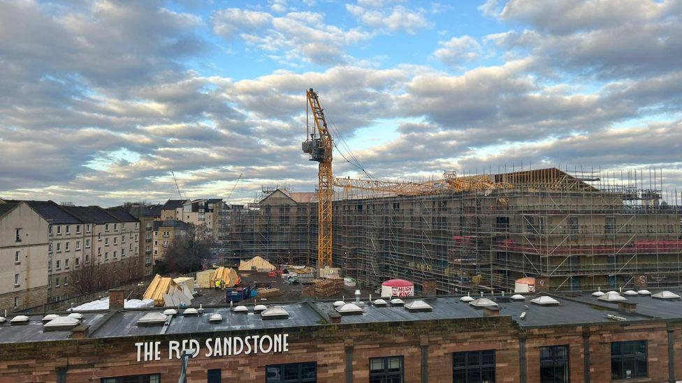 A crane has collapsed at a building site off Leith Walk