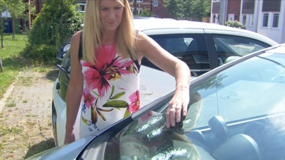 Shona Nelson in front of car