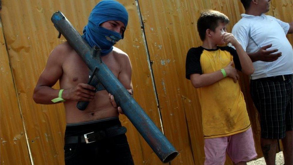 A demonstrator holds a homemade mortar during a protest after Nicaraguan President Daniel Ortega cancelled a planned overhaul of the welfare system in a bid to end protests in Managua, Nicaragua, April 22, 2018.