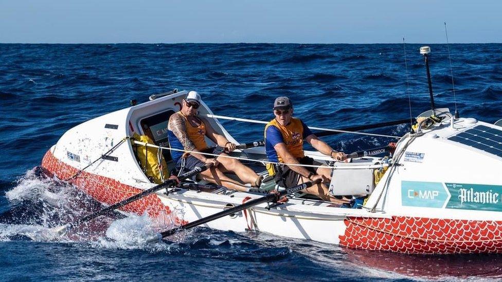 Mr Bohin and Mr Tyrell rowing