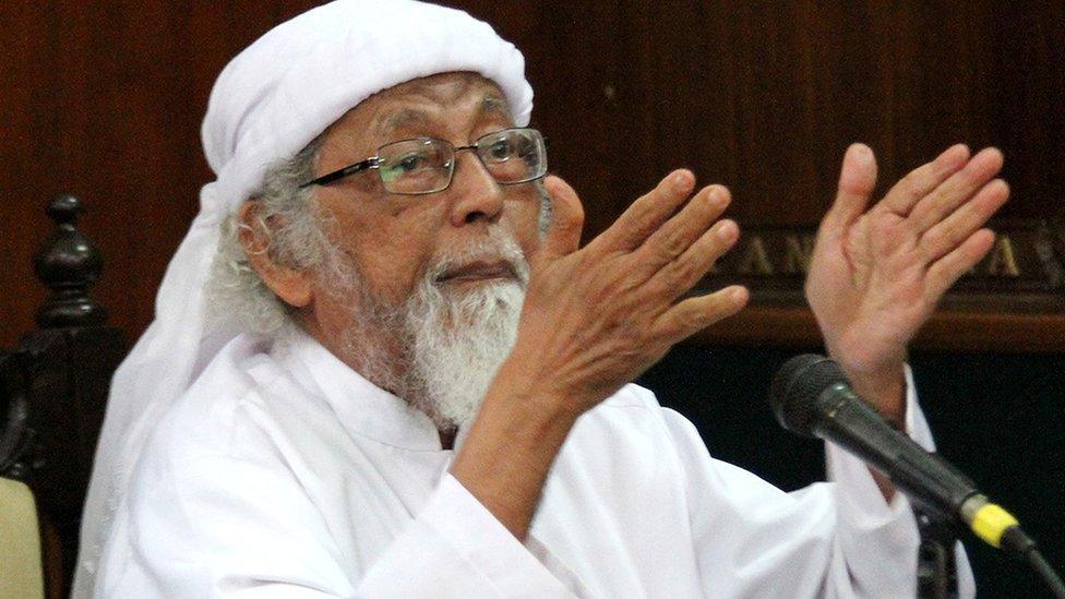 File photo taken on February 9, 2016 shows jailed Indonesian cleric Abu Bakar Ba'asyir gesturing during a court appearance in Cilacap, Central Java