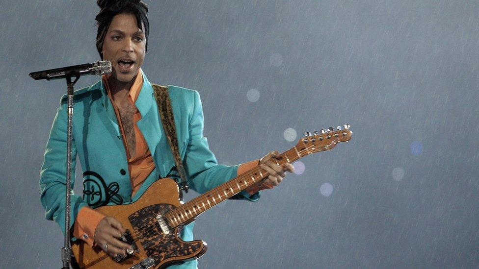 US musician Prince performs during half-time 04 February 2007 at Super Bowl XLI at Dolphin Stadium in Miami