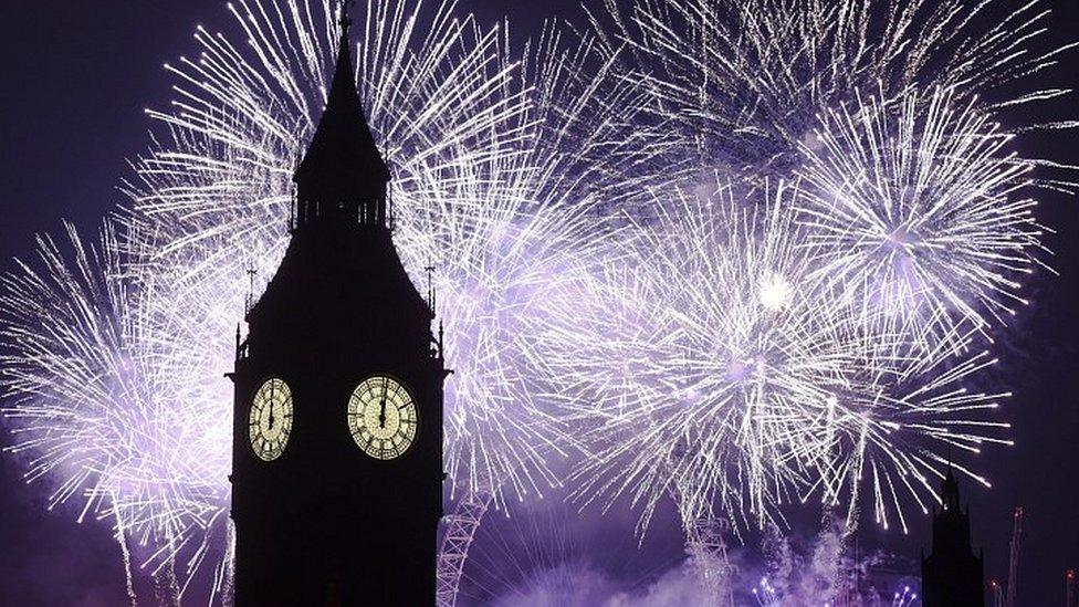 Fireworks behind the clock tower of the Houses of Parliament at midnight on New Years Eve