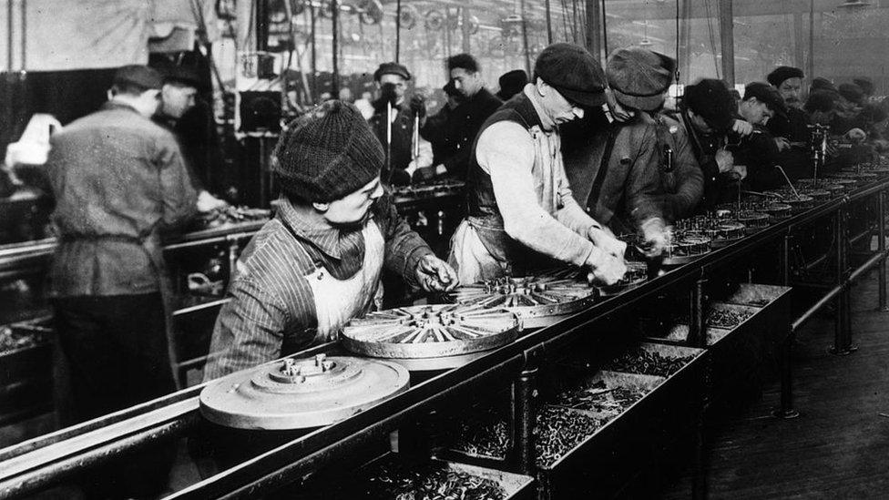 Flywheel production at the Ford motor plant in Highland Park, Michigan; 1914