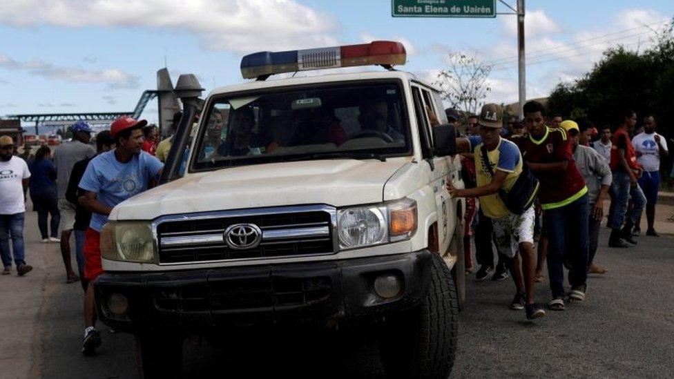 An ambulance at the scene where several people were injured during clashes in the southern Venezuelan town of Kumarakapay