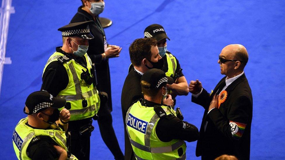 Police speak to Liberal Party members wearing yellow stars