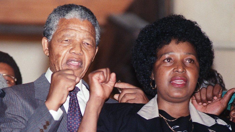 Anti-apartheid leader and African National Congress (ANC) member Nelson Mandela and wife Winnie raise fists upon Mandela release from Victor Verster prison, 11 February 1990 in Paarl