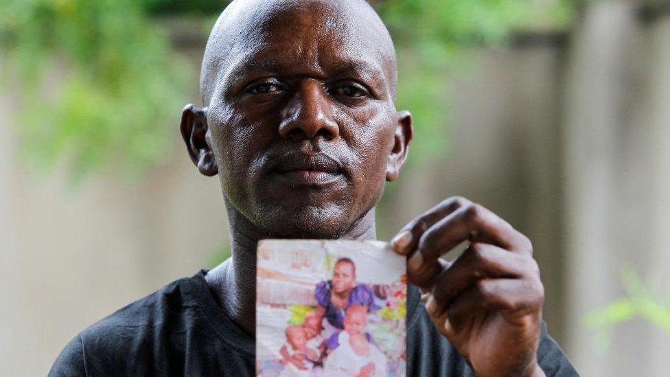 Man holding a photograph