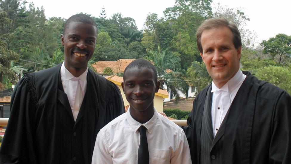 Henry with his Ugandan and American lawyer