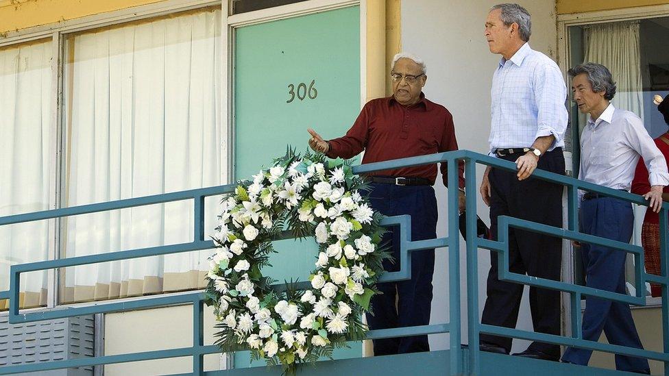 Japanese Prime Minister Junichiro Koizumi (R) of Japan and US President George W. Bush (C) are given a tour of the Lorraine Motel in Memphis, Tennessee, by civil rights leader Benjamin Hooks (L) 30 June 2006