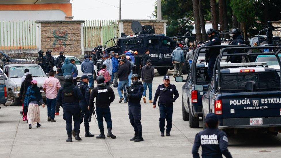 Members of the State Police stand guard in the Texcapilla sector, in the town of Texcaltitlan, in the central State of Mexico, Mexico, 11 December 2023