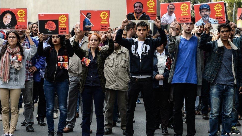 Pictures of the victims of Saturday's bomb blasts during a commemoration on October 11, 2015 in Ankara, Turkey.