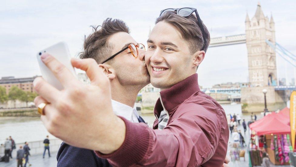 A stock image of a couple using a phone