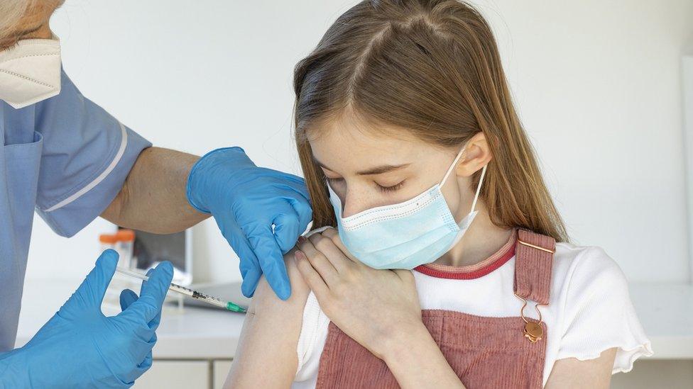 child getting vaccine