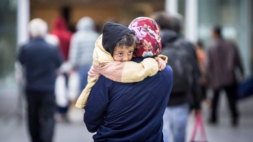 Refugees arrive at the airport train station in Duesseldorf, North Rhine Westphalia, Germany, early 09 September 2015.