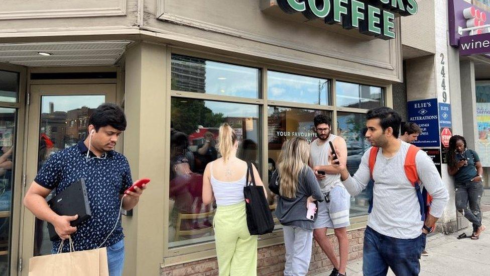 People using internet at a Starbucks