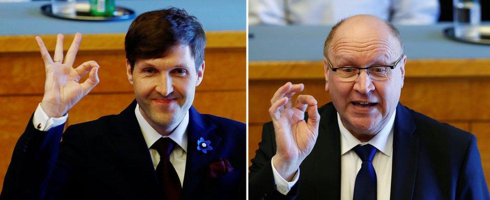 A composite image shows Martin Helme (L) and Mart Helme make the "OK" hand gesture with thumb and forefinger closed, other fingers extended, in a parliament chamber