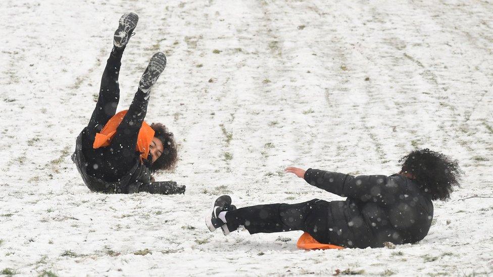 People sledging in Greenwich, south-east London