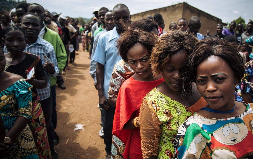 People queuing to vote