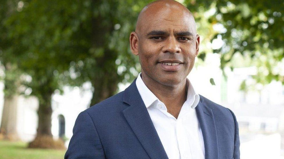 Bristol mayor Marvin Rees wearing a white shirt and blue jacket