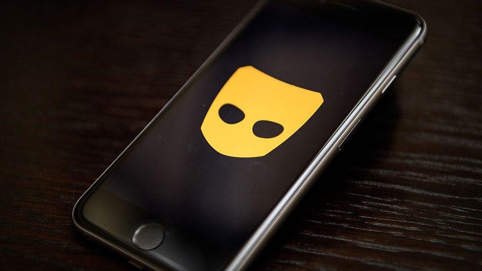 Grindr logo on phone