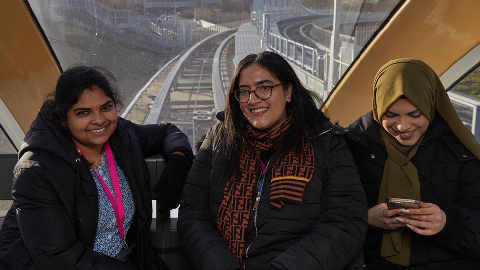 Three woman riding the Luton Dart