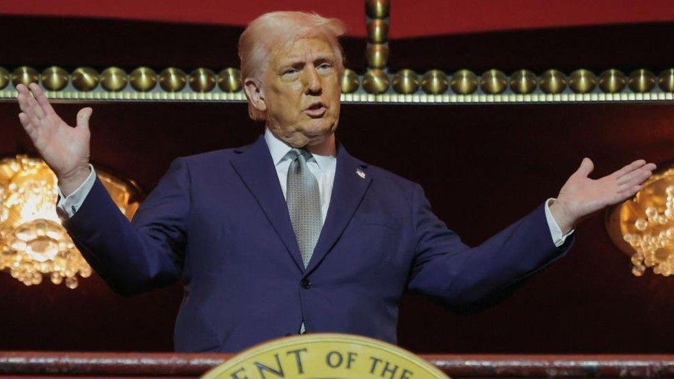 US President Donald Trump poses for a photo at the Kennedy Center