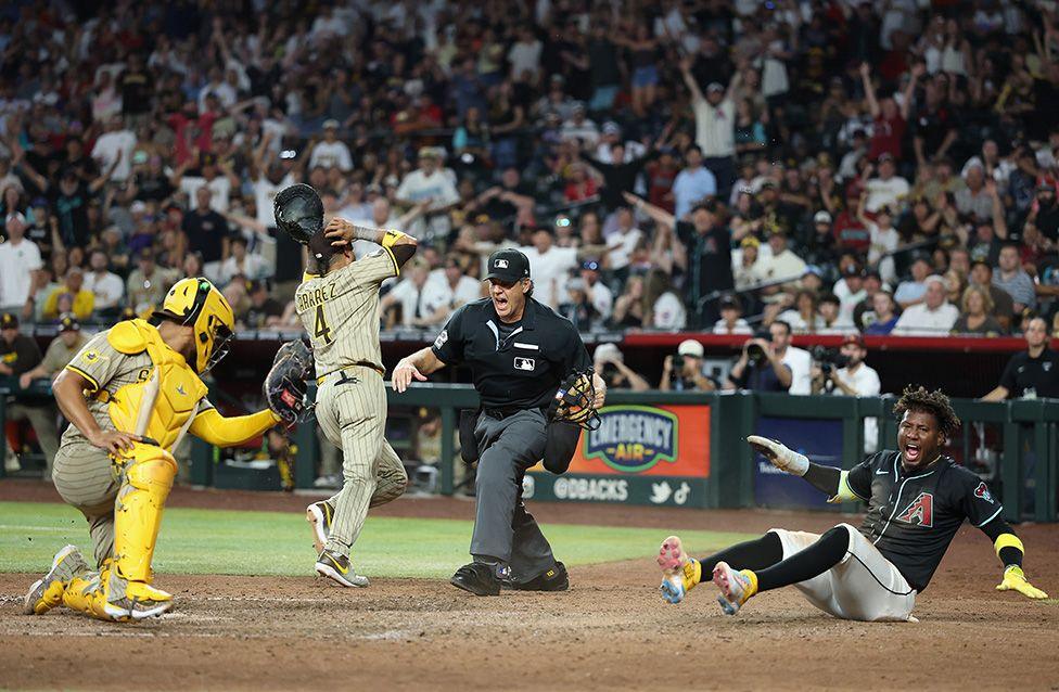 Geraldo Perdomo of the Arizona Diamondbacks reacts after scoring the game-winning run past catcher Elias Daz of the San Diego Padres during the ninth inning of the MLB game in Phoenix. Photo by Christian Petersen