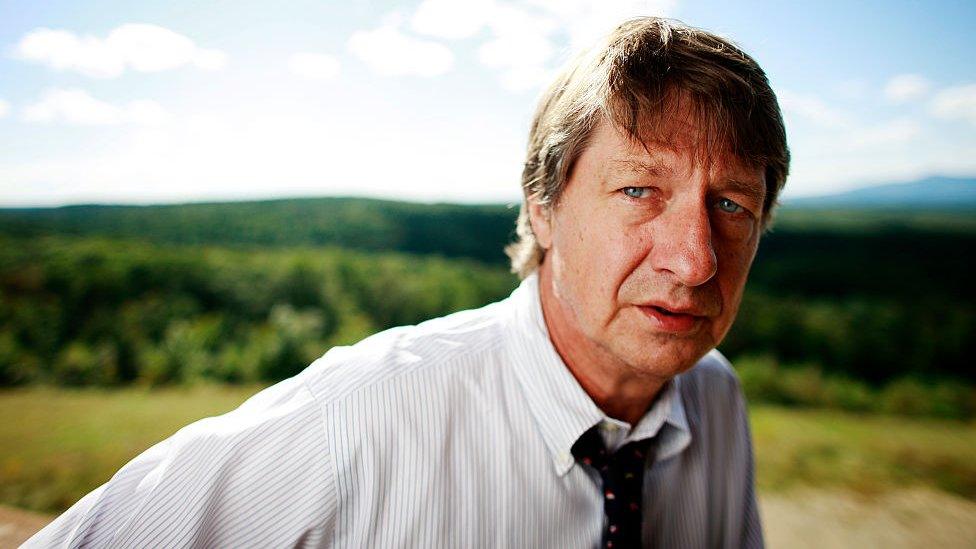 PJ O'Rourke in a field