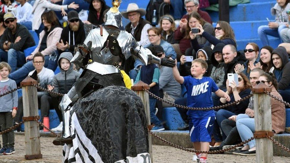 A jouster shakes hand with a spectator in Victoria, Australia