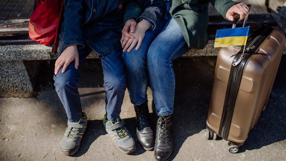 Ukrainian couple with luggage