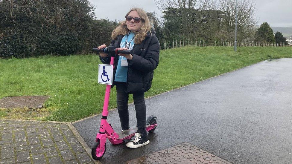 Ella Wakley on her scooter