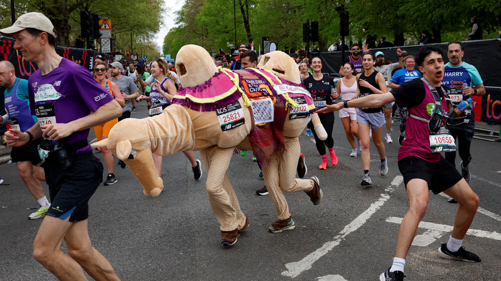 Couple running as a camel