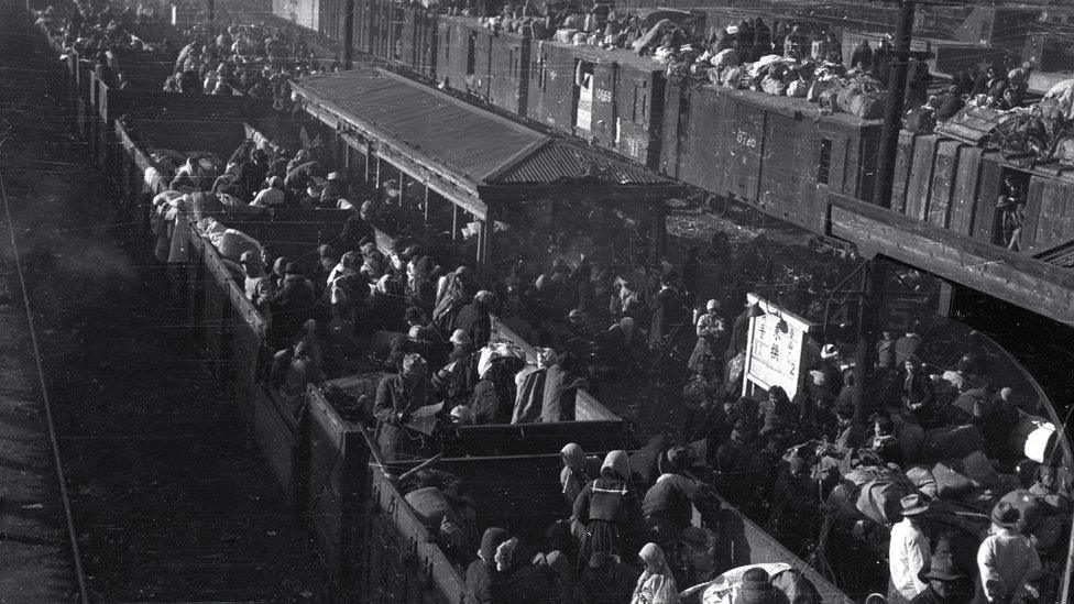 Korean refugees are aboard a train at a station in South Korea"s southeastern city of Daegu amid the Korean War, on 29 December 1950