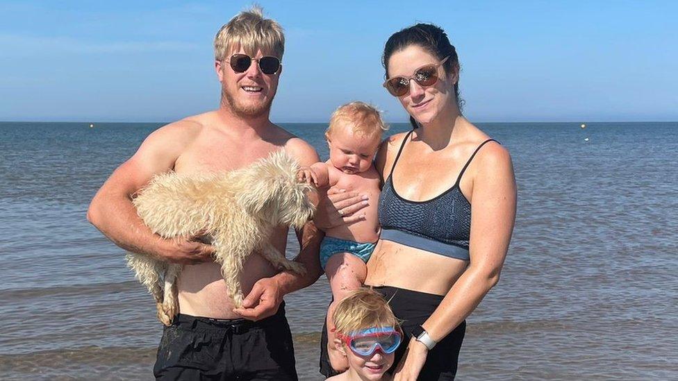 Katy Hancock with her husband Ed and children Dylan and Taylor at a beach