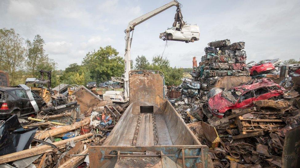 A car crusher in a scrap yard