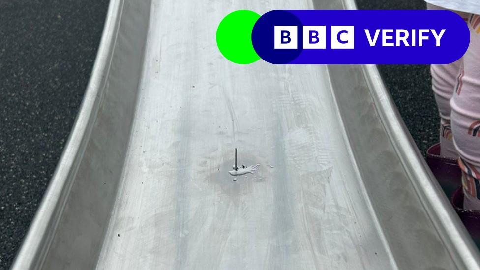 A nail glued to a playground slide