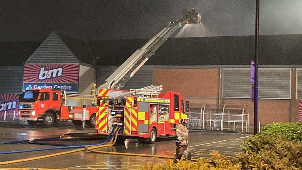 fire engine and aerial platform outside the store