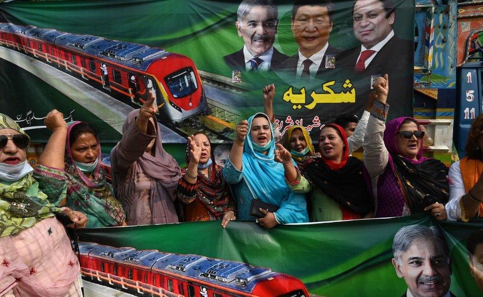 Opposition supporters of Pakistan Muslim League-Nawaz (PML-N) shout slogans after the official opening of the newly built Orange Line Metro