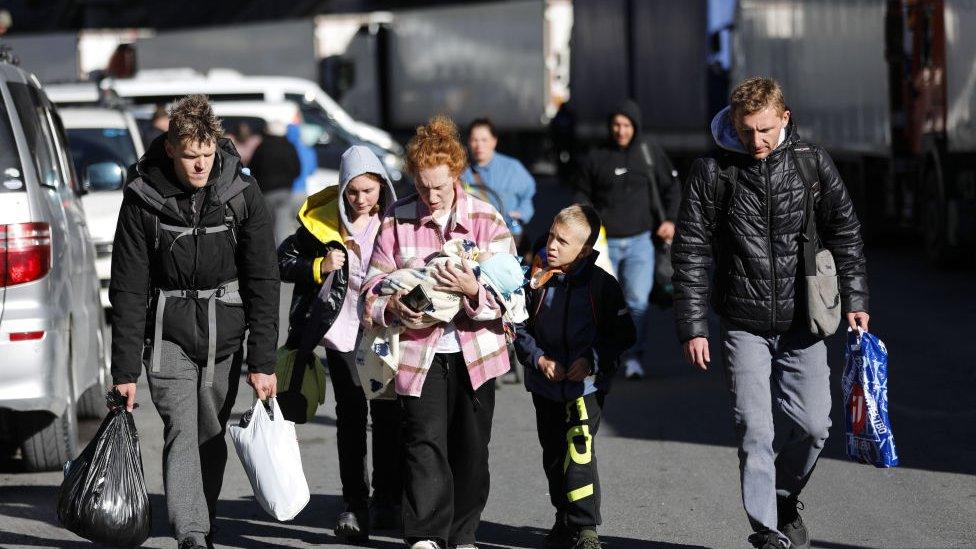 Russians are seen attempting to leave their country to avoid a military call-up for the Russia-Ukraine war as queues have formed at the Kazbegi border crossing in the Kazbegi municipality of Stepantsminda, Georgia on September 27, 2022