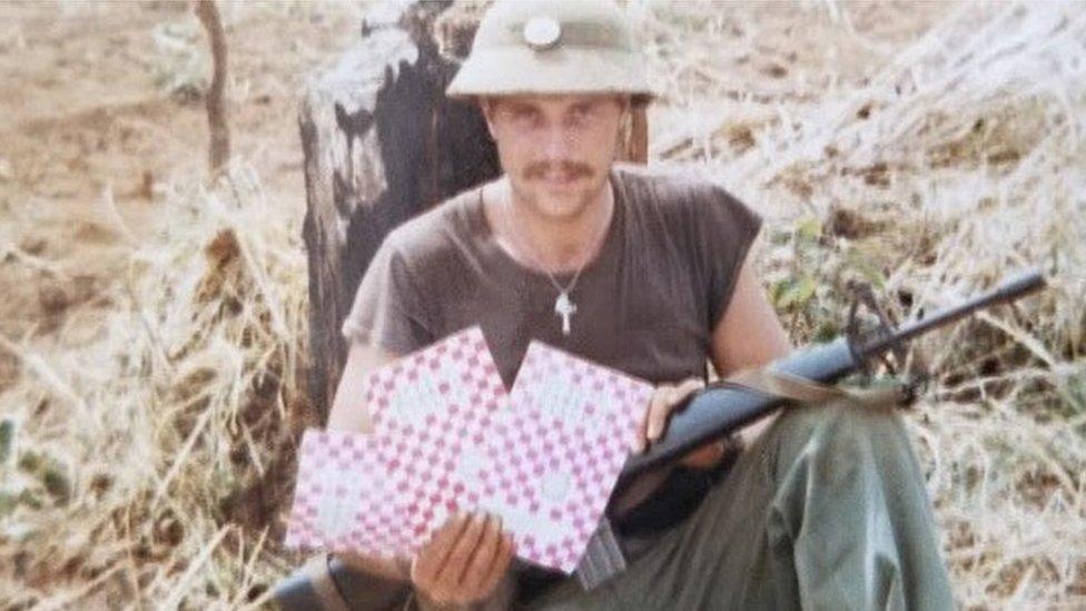 Nils Guy with programmes in Vietnam